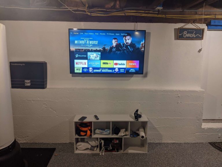 TV mounting on cement surface. Basement TV installation.